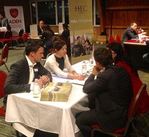 HEC Paris representatives Aidan O’Connor and Sara Vanos meet with potential students during a Bogota MBA fair.