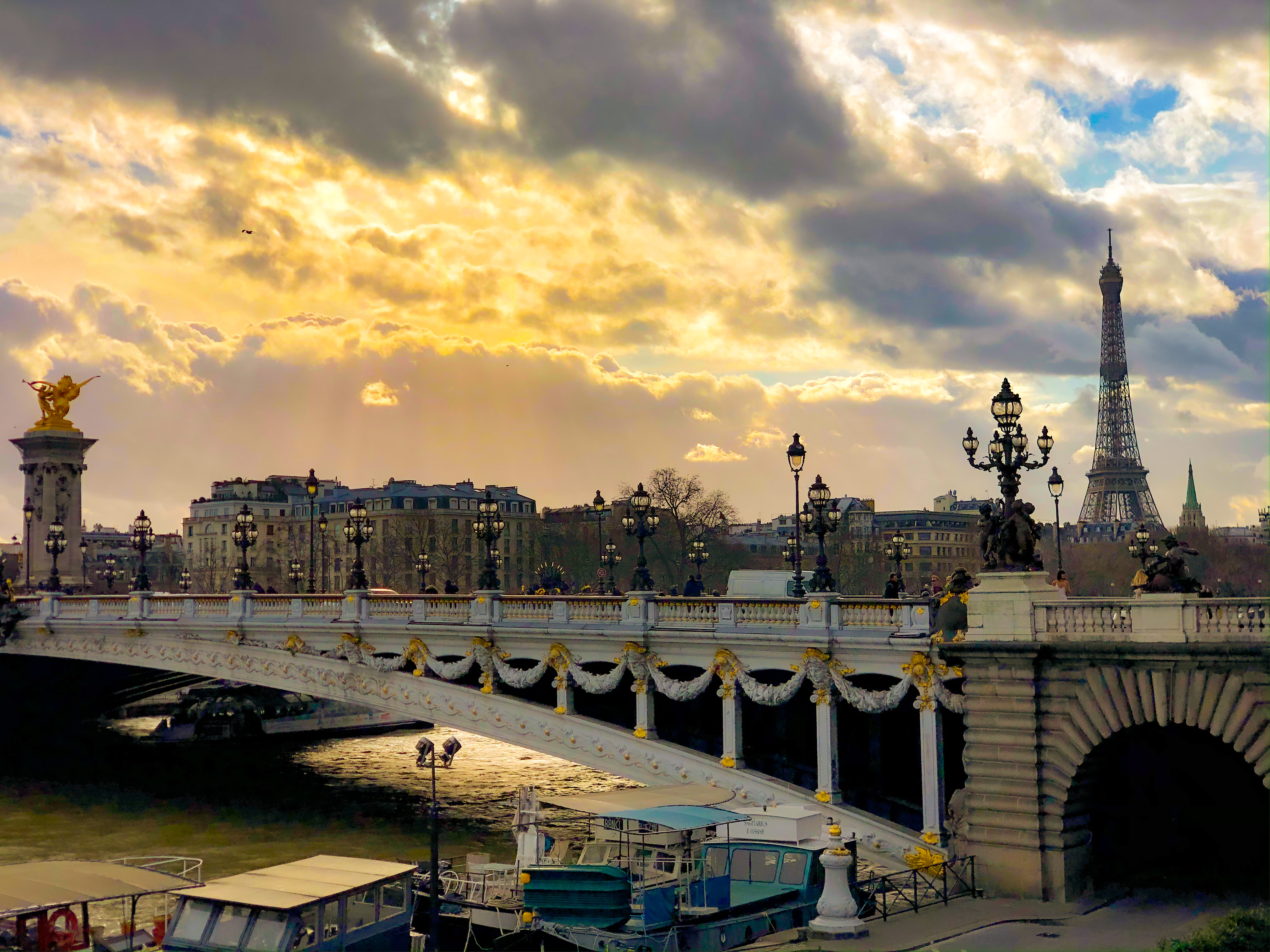 The Seine and a bridge at dusk, with the Eiffel towel in the background is part of what HEC Paris MBA students see in Europe