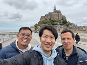 Chee Hao Lum (left) and friends at Mont-Saint-Michel