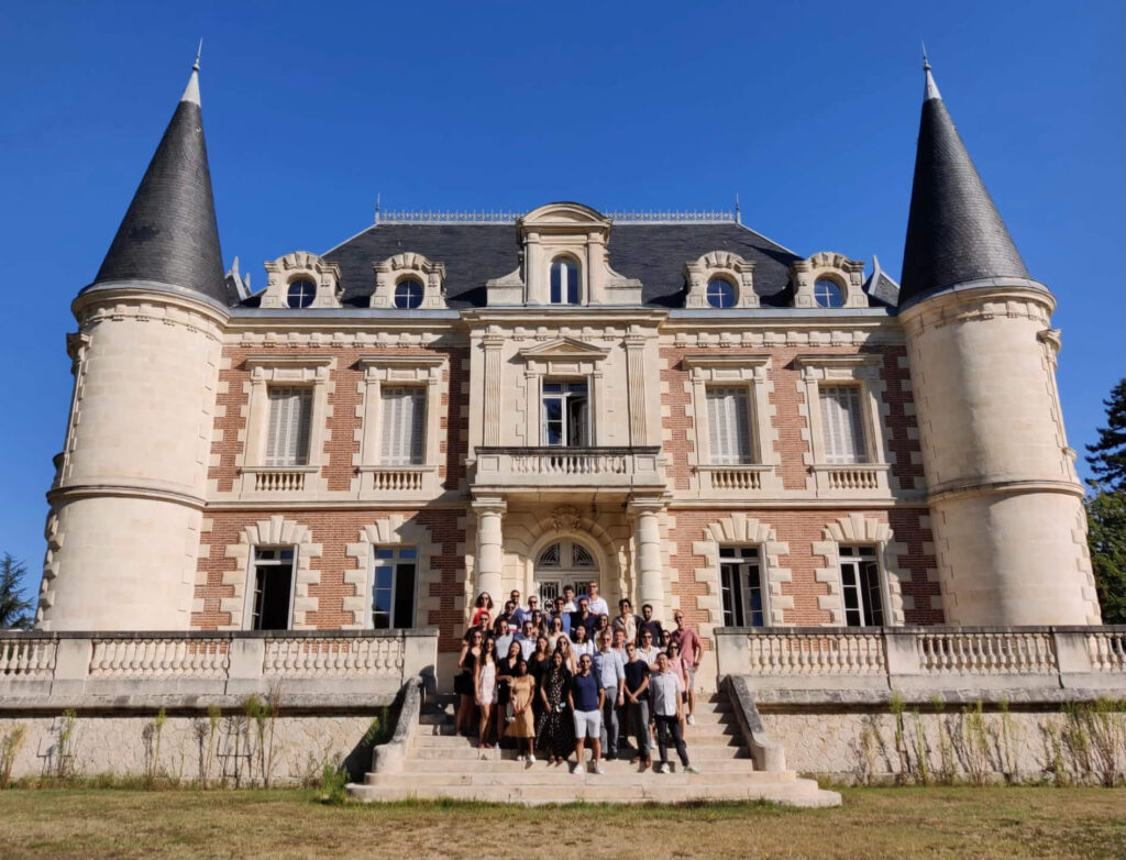 Students stand in front of the chateau at a Bordeaux winery