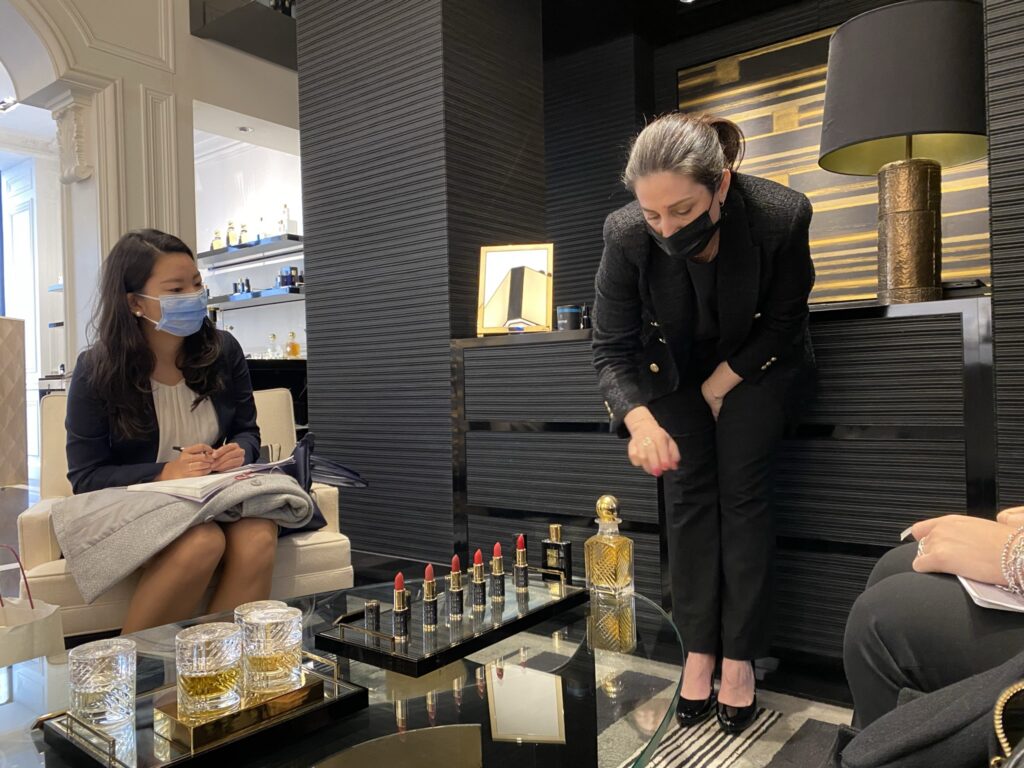 Fanny Paris, Director of the By Kilian flagship boutique, explains the detail in the By Kilian fragrance glass bottles, which are painted by hand and are refillable 
